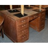 An oak pedestal desk , circa 1920, 70cm high, 66cm deep, 135cm wide