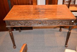 A carved oak side table, with two frieze drawers, 76cm high, 122cm wide, 66cm deep