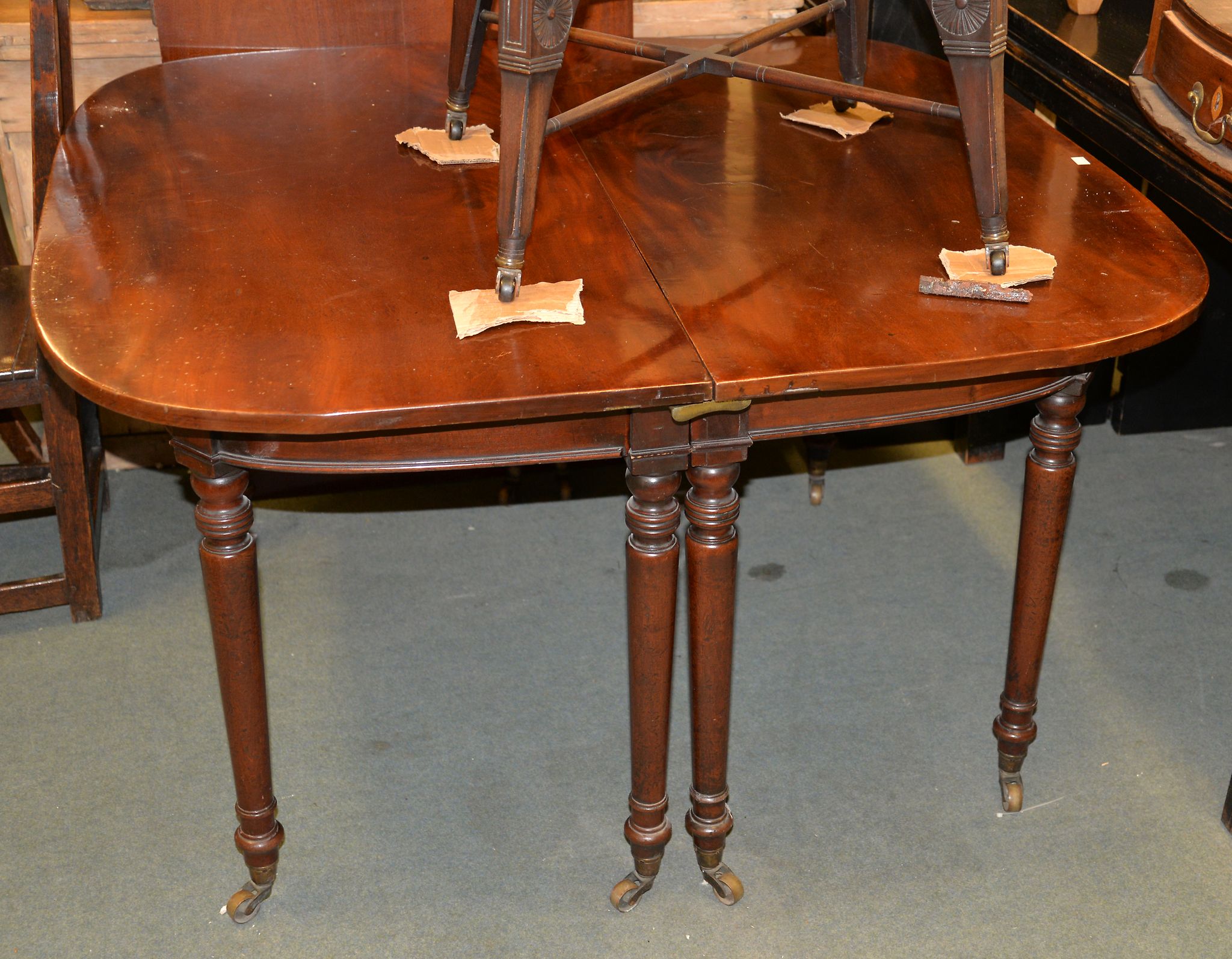 A Victorian mahogany dining table on turned legs, with one additional leaf insertion, 175cm long