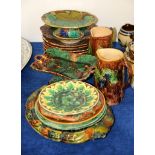 An assortment of British Majolica to include a pair of jugs, 17cm high, an oval bread plate, 33cm