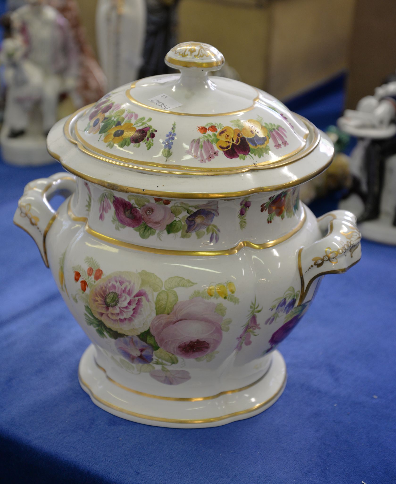 A mixed assortment of mostly ceramics including an F Pratt type plate, a Toby jug, and other items