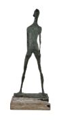 An abstract bronze figure of a standing nude on a stepped painted pine base, in the manner of Dame