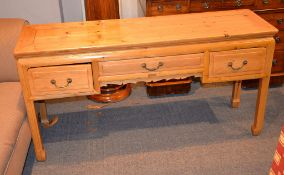A pitch-pine low side table in Chinese taste, with three frieze drawers, 70cm high, 137cm wide, 40cm