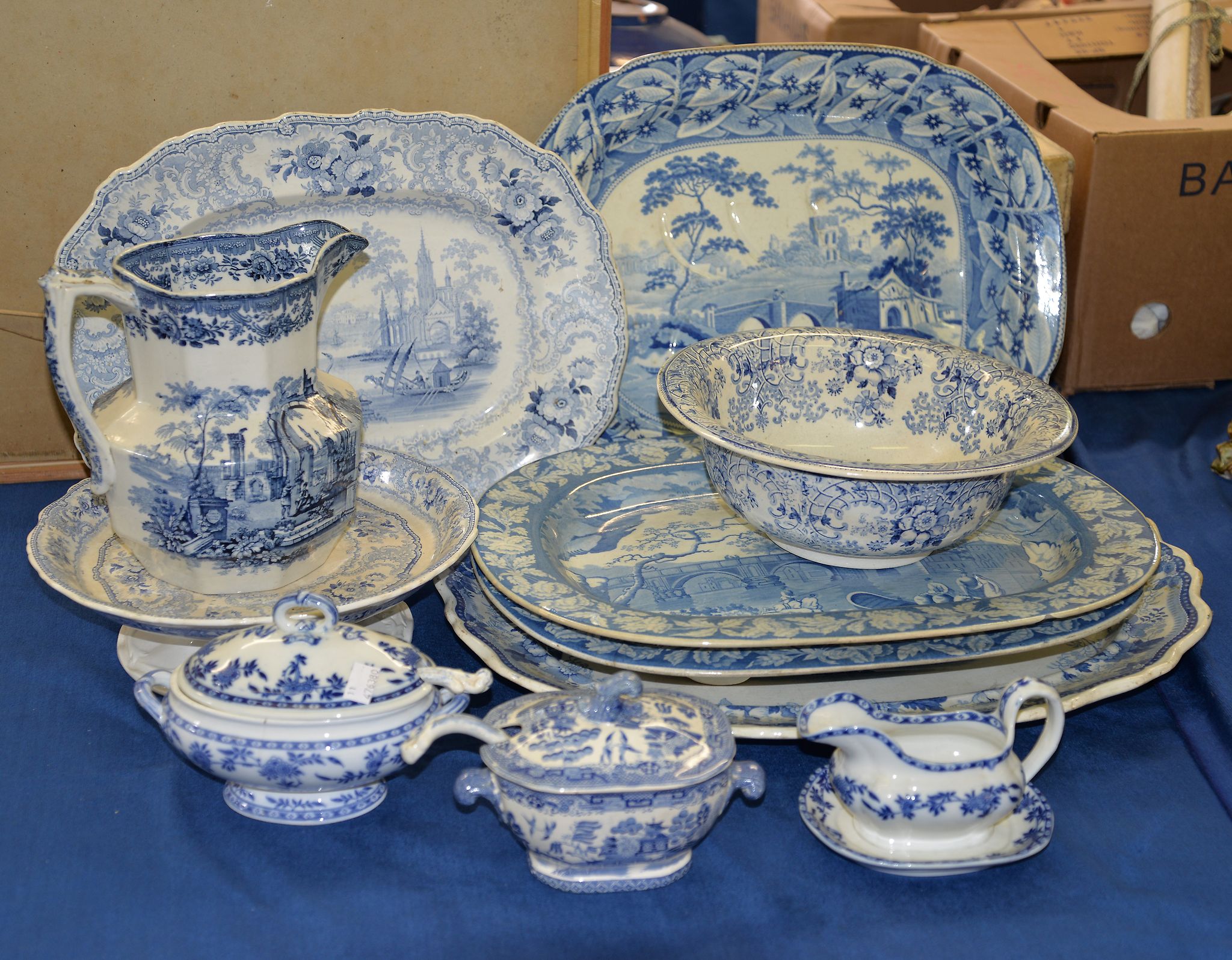 An assortment of Staffordshire blue and white printed pottery, var ious dates, mostly 19th