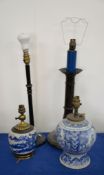 A Dutch Delft baluster vase, 18th century, fitted for electricity as a lamp, and other lamps