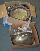 Two boxes containing a quantity of silver plated items including trays, meat covers, etc.