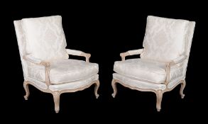 A pair of carved beech and damask upholstered armchairs, in Louis XV style , 20th century, each