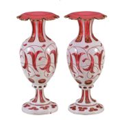 A pair of Bohemian glass ruby-flashed baluster vases with turned over shaped rims , circa 1860,