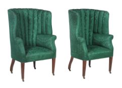 A pair of beech and damask upholstered wing armchairs, in George III style , late 19th/early 20th