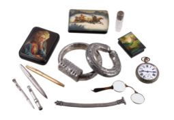 A collection of objects, including: two Arabic silver coloured hollow bangles; an Arabic silver