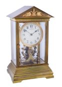 A lacquered brass four-glass cased electromagnetic balance mantel timepiece Eureka Clock Company