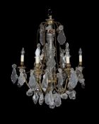 A Continental gilt metal and moulded and cut glass six light chandelier in Louis XV taste, mid-20th