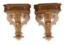 A pair of Italian carved, painted and giltwood wall brackets, early 20th century, the rectangular