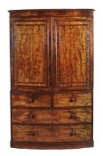 A George IV mahogany bowfronted linen press, circa 1825 , the moulded cornice above a pair of