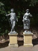 A pair of cast lead garden models of a shepherd and a shepherdess in the manner of 18th century