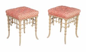 A pair of painted and parcel gilt stools in 'Brighton Pavilion' taste , early 20th century, legs