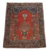 A Kashan prayer rug , decorated with a vase of flowers within the mihrab, approximately 196cm x