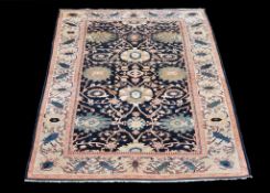 A Ziegler carpet , with perfuse floral decoration, approximately 550cm x 318cm Provenance: The
