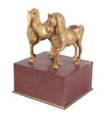 A pair of Italian gilt bronze models of horses , late 19th century, after two of the four Roman