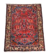 A Bakhtiar rug, with perfuse stylised decoration, approximately 255cm x 149cm Provenance: The