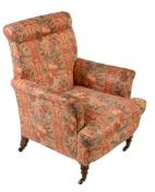 A Victorian walnut and upholstered armchair, circa 1880, with outscrolled arms and back above