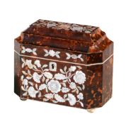 Ω A late George III tortoiseshell canted rectangular tea caddy , inlaid in mother of pearl with