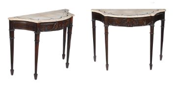 A pair of mahogany side tables in George III Irish style, late 19th/early 20th century, each with a
