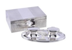 A silver oval double inkwell by A. & J. Zimmerman, Birmingham 1915, 20cm (8in) long, loaded; and an