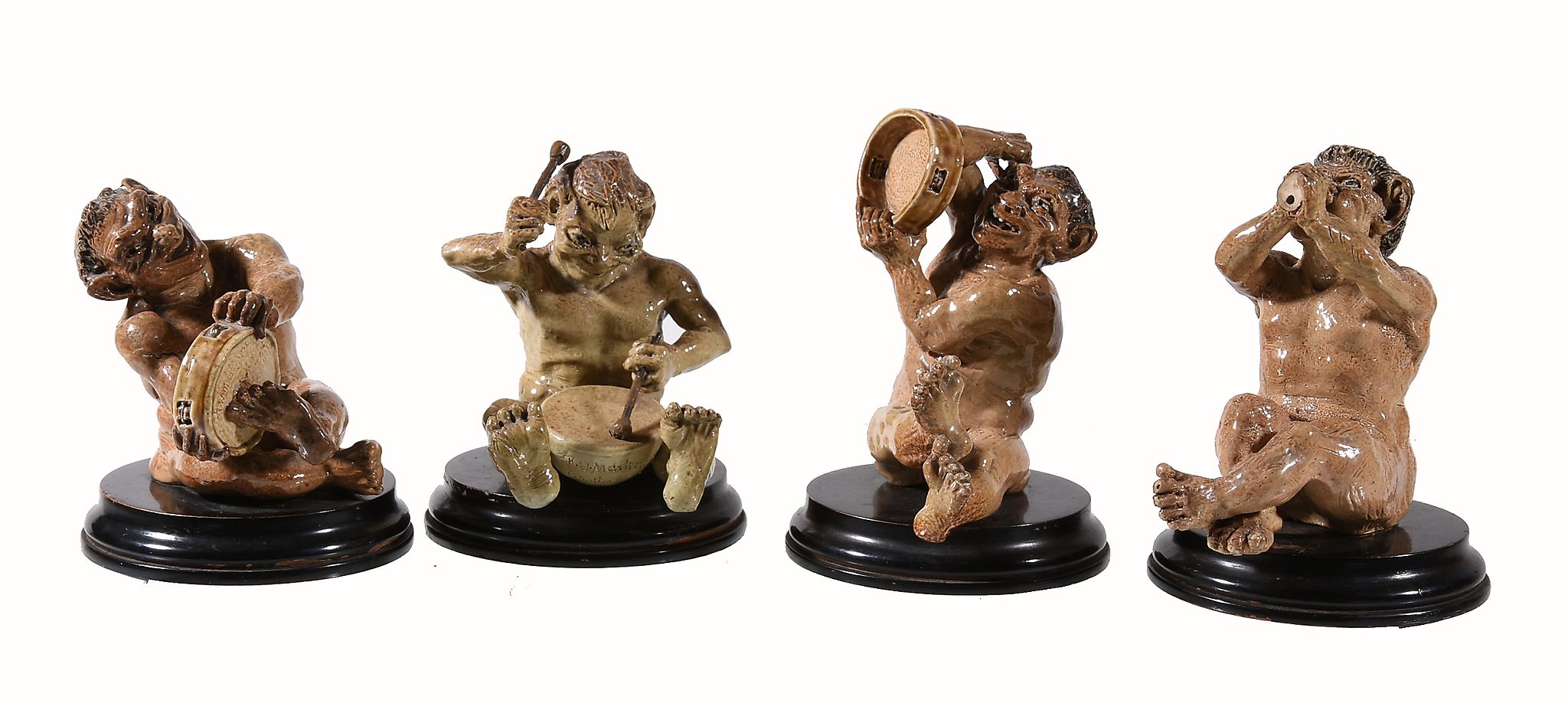 A set of four Martin Brothers stoneware grotesque figures of imp musicians A set of four Martin