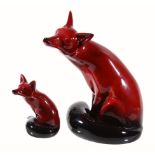 A Royal Doulton Flambé model of a fox, printed mark, signed Noke, 24cm high; and another smaller,