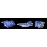 Three substantial specimens of polished lapis lazuli, of irregular naturalistic form, one example