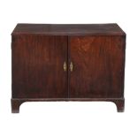 A George II mahogany cupboard, circa 1750, the caddy moulded top above a pair of cupboard doors,