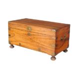 A camphor and brass bound trunk, second half 19th century, of small proportion, on turned bun feet,