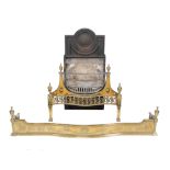 A cast iron, steel and brass mounted firegrate in George III style, early 20th century, the arched