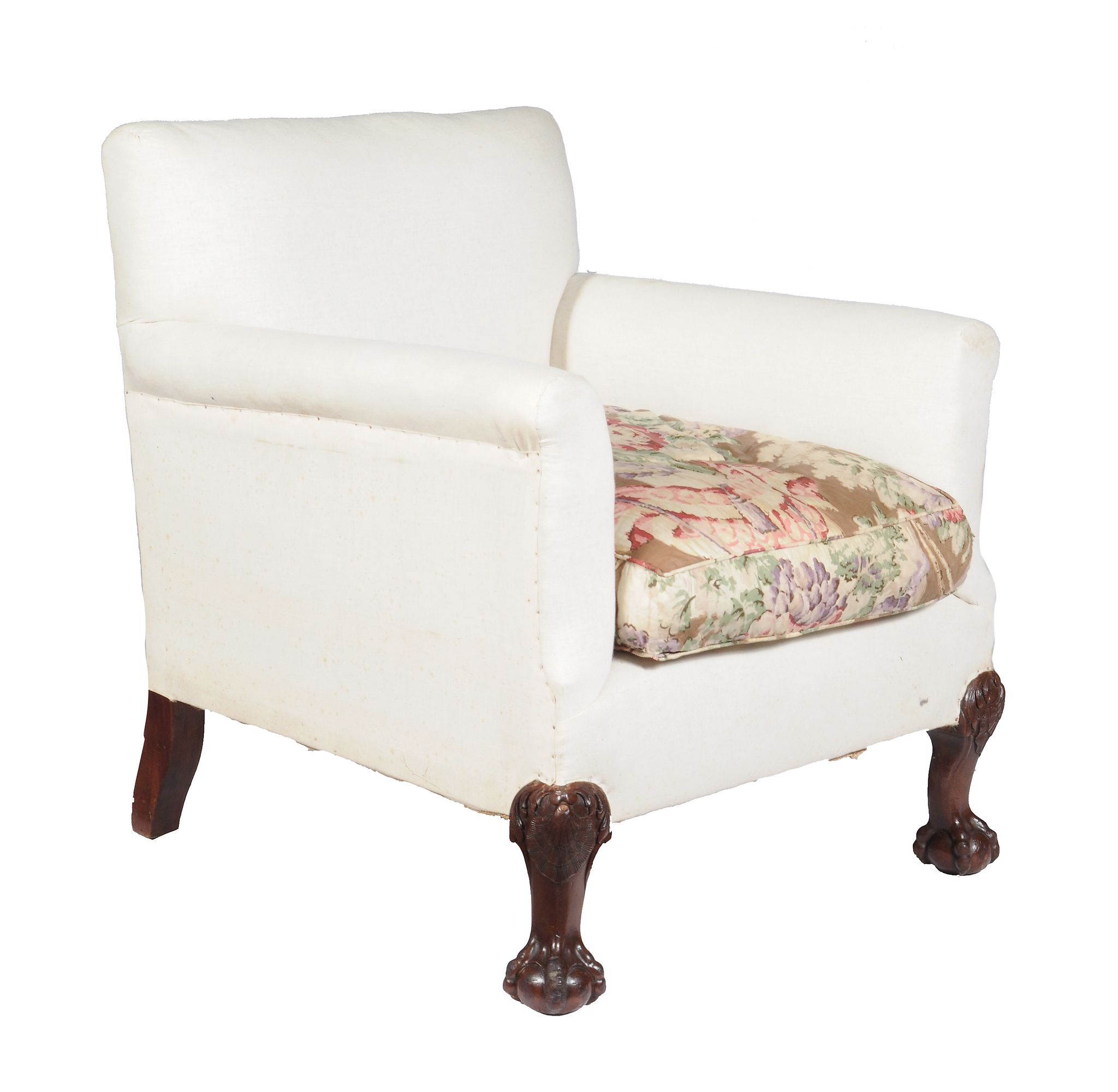 A mahogany and upholstered armchair by Howard and Sons , early 20th century, upholstered in white