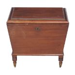 A George IV mahogany wine cooler , circa 1825, in the manner of Gillows, the lid enclosing a zinced