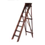 A stained wood ladder in Victorian style , each step with a brass tread, 183cm high
