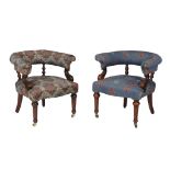 A Victorian desk chair , circa 1870, and a later example to match, in differing upholstery, each