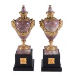 A pair of gilt metal mounted pink and striated white marble urns, second half 20th century, the