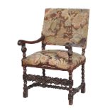 A Continental carved walnut armchair , circa 1700 and later, the frame carved with acanthus and