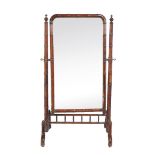 A mahogany cheval mirror , second half 19th century, the frame to simulate bamboo, 168cm high, 91cm