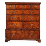 A walnut and feather banded chest on stand, early 18th century and later, with moulded cornice