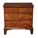 A field maple chest of drawers , early 18th century and later, the rectangular top with feather