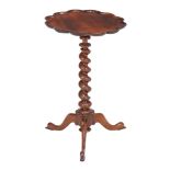 Ω An early Victorian rosewood wine table , circa 1840, the top with beaded waved edge, 71cm high,