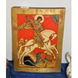 A painted and parcel gilt wood Russian icon of Saint George and the Dragon, 20th century, 32 x 24cm