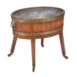 A George III brass bound mahogany oval wine cooler , circa 1780, with metal liner, of coopered