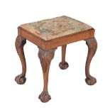 A George II mahogany stool , circa 1750, the rectangular drop-in seat and plain frieze above leaf