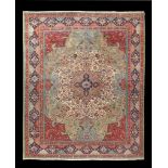 Sarouk carpet, the ivory field with a sand coloured lobed medallion centred by a flowerhead, all on