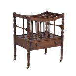 A George IV mahogany Canterbury, circa 1825, the trellis frame above a frieze drawer and turned