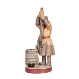 A Moscow biscuit porcelain figure of a Russian peasant breaking a hole in the ice, mid 19th